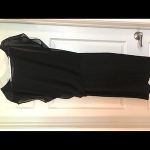 Black dress, flowy at top, straight at bottom